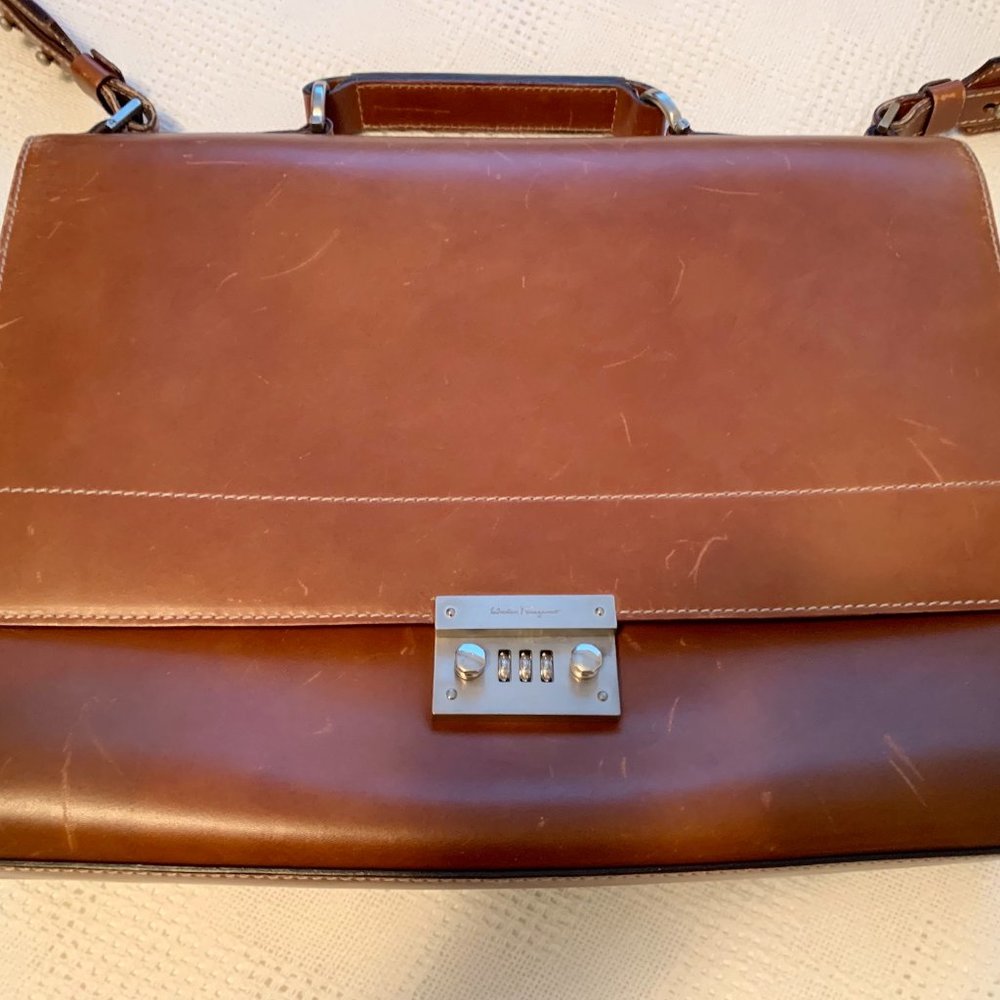 Salvatore Ferragamo Leather Briefcase with adjustable canvas strap.